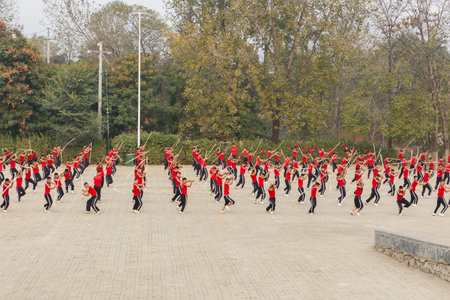 Dengfeng, China - October 16, 2018: Pupils of martial arts school train on the square. Shaolin Temple Kungfu School.のeditorial素材