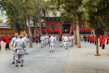 Dengfeng, China - October 16, 2018: Pupils of the martial arts school are preparing for performance on the main square in front of the Shaolin Temple.のeditorial素材