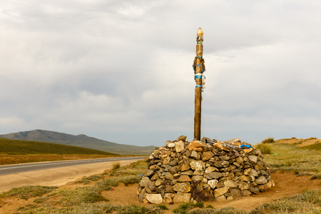 Mongolian Ovoo, Sacred pass in Mongolian desert mountains, Mongolia.の写真素材