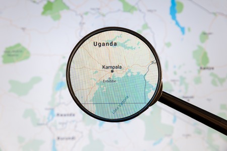 Kampala, Uganda. Political map. City visualization illustrative concept on display screen through magnifying glass.の写真素材