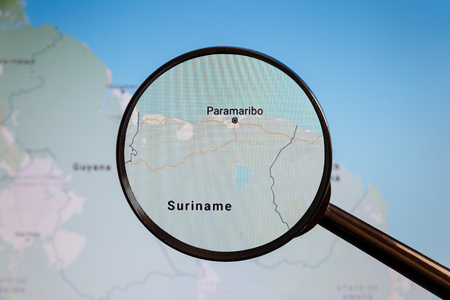 Paramaribo, Suriname. Political map. The city on the monitor screen through a magnifying glass.の写真素材