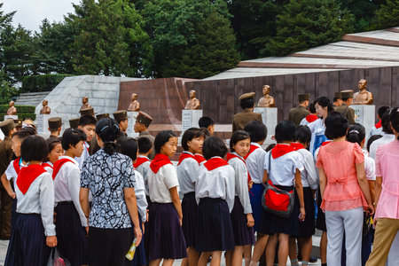 Pyongyang, North Korea - July 27, 2014: Korean schoolchildren at the memorial cemetery of revolutionaries in Pyongyang.のeditorial素材
