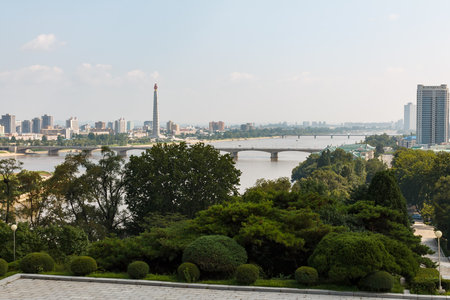Pyongyang, North Korea - July 27, 2019: View of the Pyongyang city and the Teadong River. Tower of...