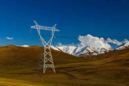 pylons of high-voltage power lines in the mountains, kyrgyzstan, energy landscapeの写真素材