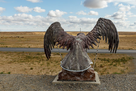 Kazaly District, Kazakhstan - August 31, 2019: Eagle statue with spread wings on the mountain in the steppe of Kazakhstan.のeditorial素材