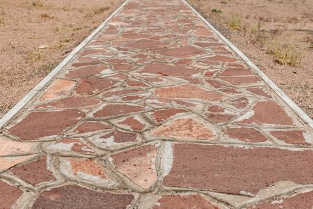 Stone walkway, Akyrtas Palace Complex in Kazakhstan. The path of red stone on the territory of the complex.の写真素材