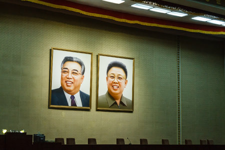 Pyongyang, North Korea - July 29, 2014: Portraits of Kim Il Sung and Kim Jong Il on the wall in the auditorium of the Grand People's Study House in Pyongyang.のeditorial素材