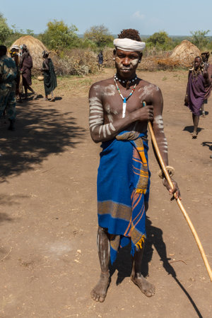 Omo Valley, Mursi village, Ethiopia - December 07, 2013: Young man from Mursi tribe. Man from the...