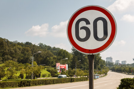 Pyongyang, North Korea - July 27, 2014: Road sign on the street in Pyongyang. Sungri Street.のeditorial素材