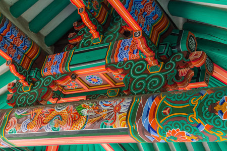 Pyongyang, North Korea - July 27, 2014: Korean architecture. colorful wooden roof of gazebo painted in traditional Korean style. Moranbong Parkのeditorial素材