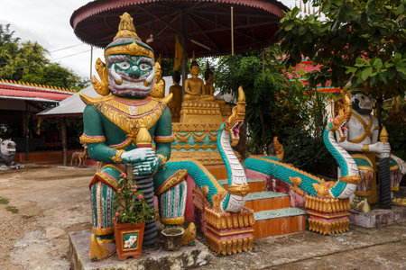 Ban Pak Ton, Vientiane Prefecture, Laos - December 09, 2018: Statues at the entrance to a Buddhist temple. Ban Pak Ton village.のeditorial素材