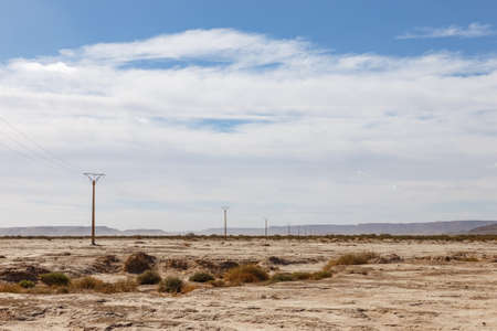 Electric power line in Sahara Desert. Moroccoの写真素材