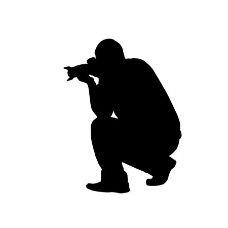 Vector silhouette of a man with a camera on a white background.のイラスト素材
