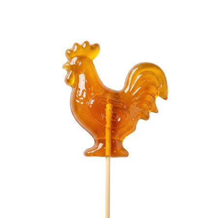 Rooster-shaped translucent caramel lollipop on a wooden stick, sweet treat, featuring a classic design for traditional candy.の素材