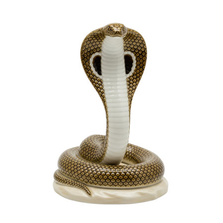 A porcelain figurine of a king cobra snake in a defensive pose. This classic animal statuette is a symbol of power and danger.の素材