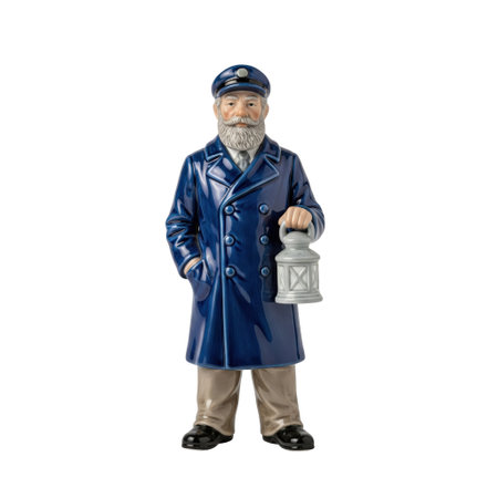 Vintage porcelain figurine of a lighthouse keeper with a beard, holding a lantern. This nautical statuette is a classic souvenir.の素材