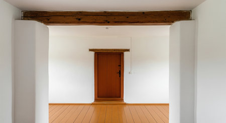 Minimalist white room interior with wooden floor ceiling beam and brown door in center, simple rustic house hallway design view.の素材