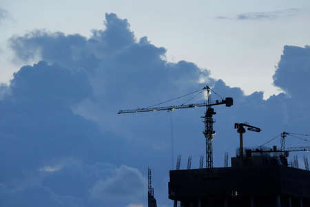 Construction crane in sunset, Construction site and beautiful sky.の写真素材