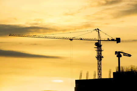 Construction crane in sunset, Construction site and beautiful sky.の写真素材