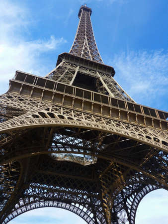 Landmark Eiffel Tower and blue sky low angle in Paris, Franceの写真素材