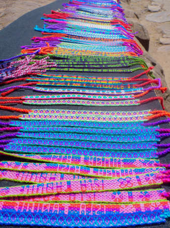 Many handmade bracelets lined up as souvenirs in Peruの写真素材