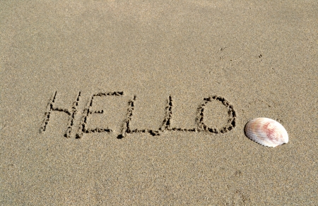 Beach with the word Hello written in the sandの写真素材