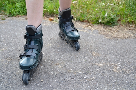 Girl with inline skates on the roadの写真素材