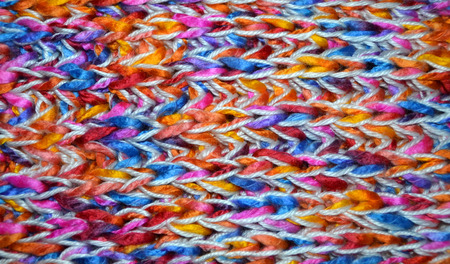 Texture of knitting wool in blue, orange, red, pink and white colorの写真素材