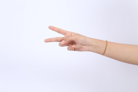 Elegant female palm or wrist isolated on white. counting with two (2) fingersの写真素材