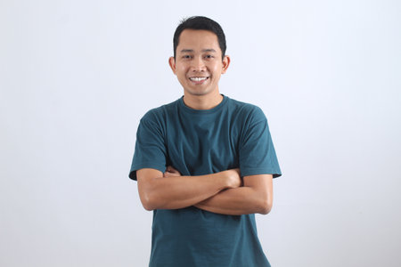 Portrait of a happy and successful young Asian professional looking at camera with a friendly smile....
