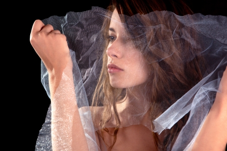 Portrait of a girl on the black backgroundの写真素材