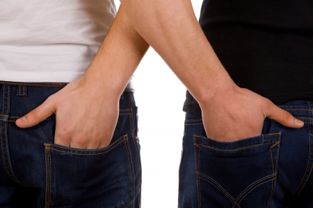 Two young gay man hugging each otherの写真素材