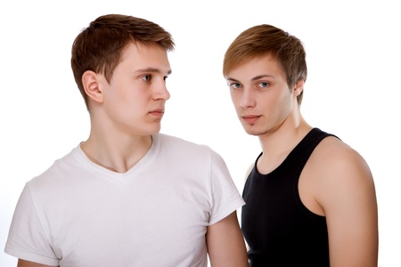 Portrait of two young boys gay on a black backgroundの写真素材