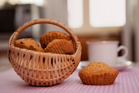 Fresh pastries and a cup of tea on the tableの写真素材
