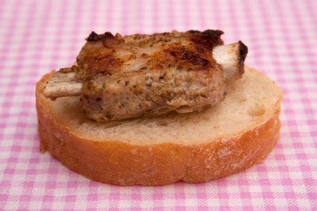 Grilled meat on a bread with spices and herbsの写真素材