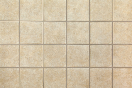 Beige ceramic tiles on the wall. Design background.の写真素材
