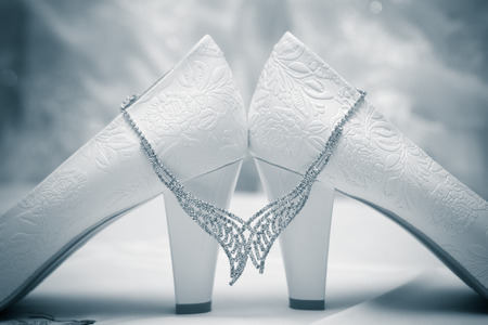 Black and white photo bride wedding shoes with necklaceの写真素材