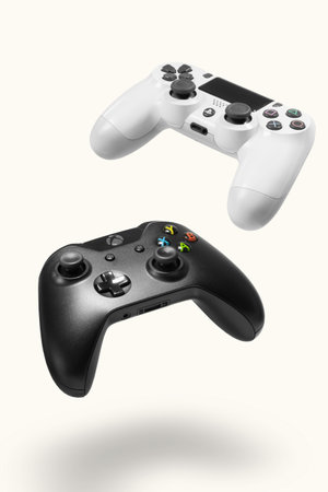 Playstation 4 and Xbox One controllers on white background, Sao Paulo, Brazil - 10/03/2020