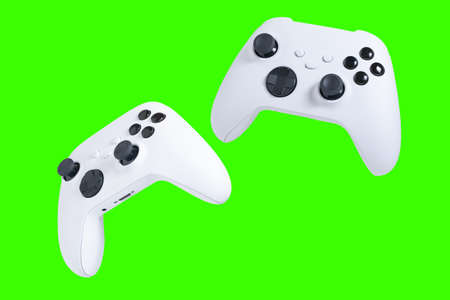 Game controllers with green background for clippingの写真素材