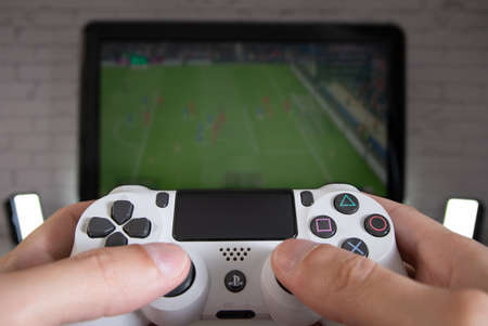Playing Playstation 4 on TVのeditorial素材