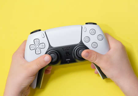 Playstation 5 Dual Sense controller on kid hand - Sao Paulo, Brazil - 11/23/2020