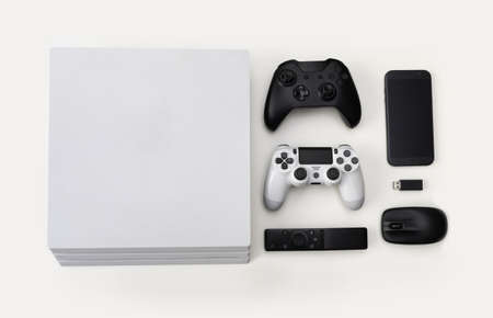 Game consoles, controllers, smarthphone, tv control and mouse, technology stuff in top view