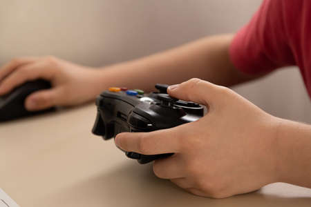 Boy playing game on computer - Sao Paulo, Brazil - 09/02/2020の写真素材