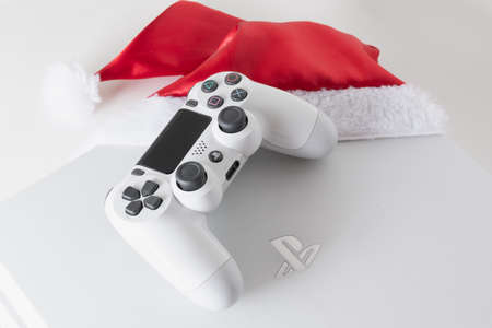 Playstation 4 console and controller with Santa Claus hat, Sao Paulo, Brazil - 15/09/2020