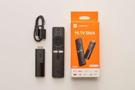 MI TV Stick device, control, cables and box. 3 Jun, 2021, Sao Paulo, Brazil.