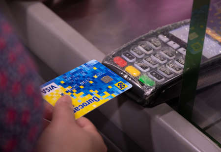 Sao Paulo/Brazil - 08/10/2020: CAIXA bank card being used in a plastic-covered machine in Brazil.のeditorial素材