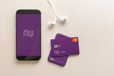 SÃ£o Paulo/SP/Brazil - 07/23/2020: Nubank Card and Nubank logo on the screen of the mobile device. Nubank is a Brazilian company in the segment of financial services and digital bank. largest fintech in Latin America.のeditorial素材