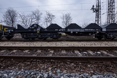Burgas, Bulgaria - January 24, 2017 - Freight cargo train - 6-axled flat wagon - Sahmmn - WW 604 A- Transvagon ADのeditorial素材