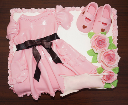 Pink dress cake with shoes and flowers christening and baptismの写真素材