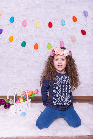 Cute little girl in a Easter decoration at Homeの写真素材